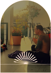 Sa’rellan seated in quiet reflection on a covered terrace
